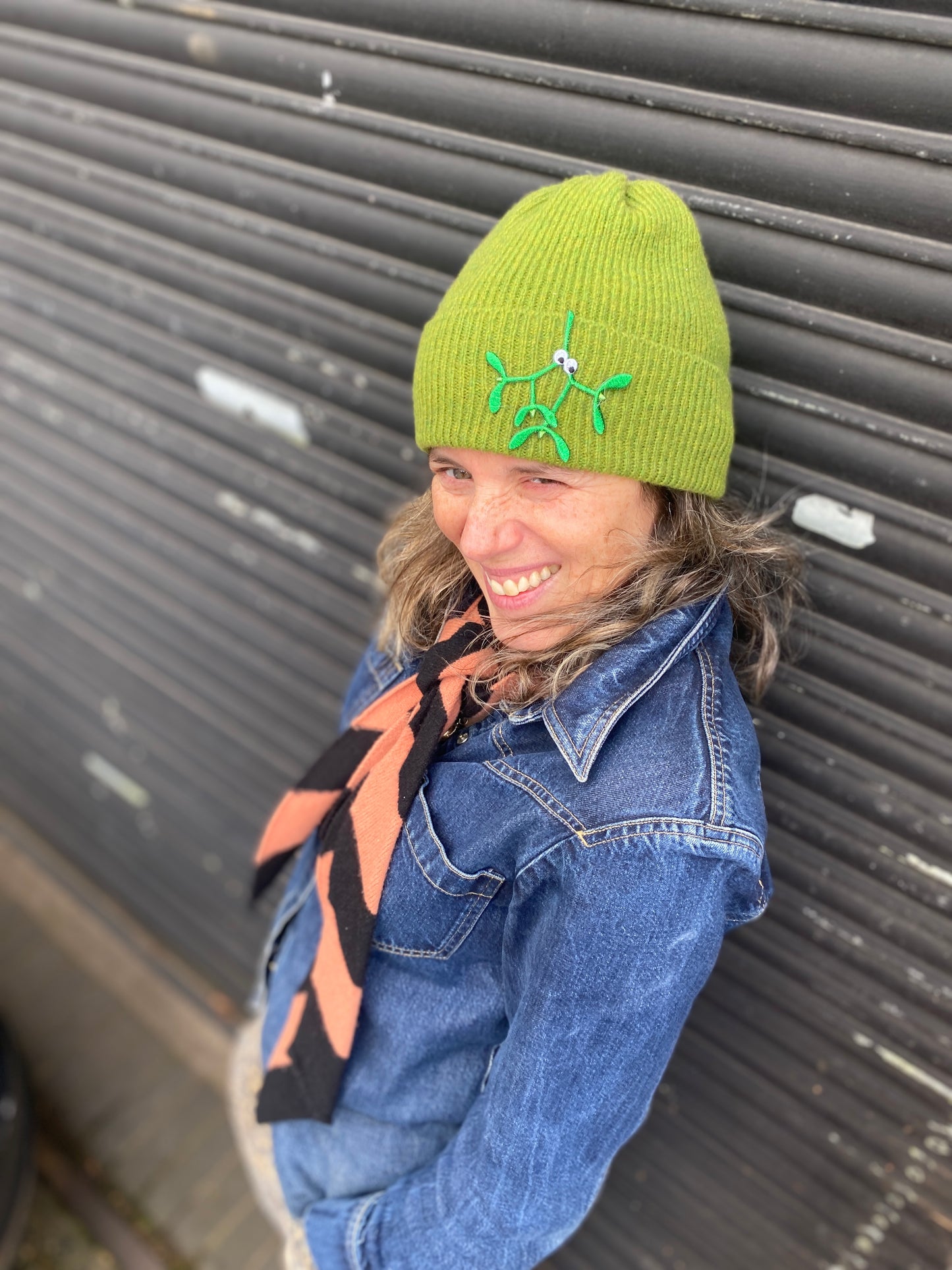 Petra boase wearing green Christmas beanie with mistletoe iron on patch