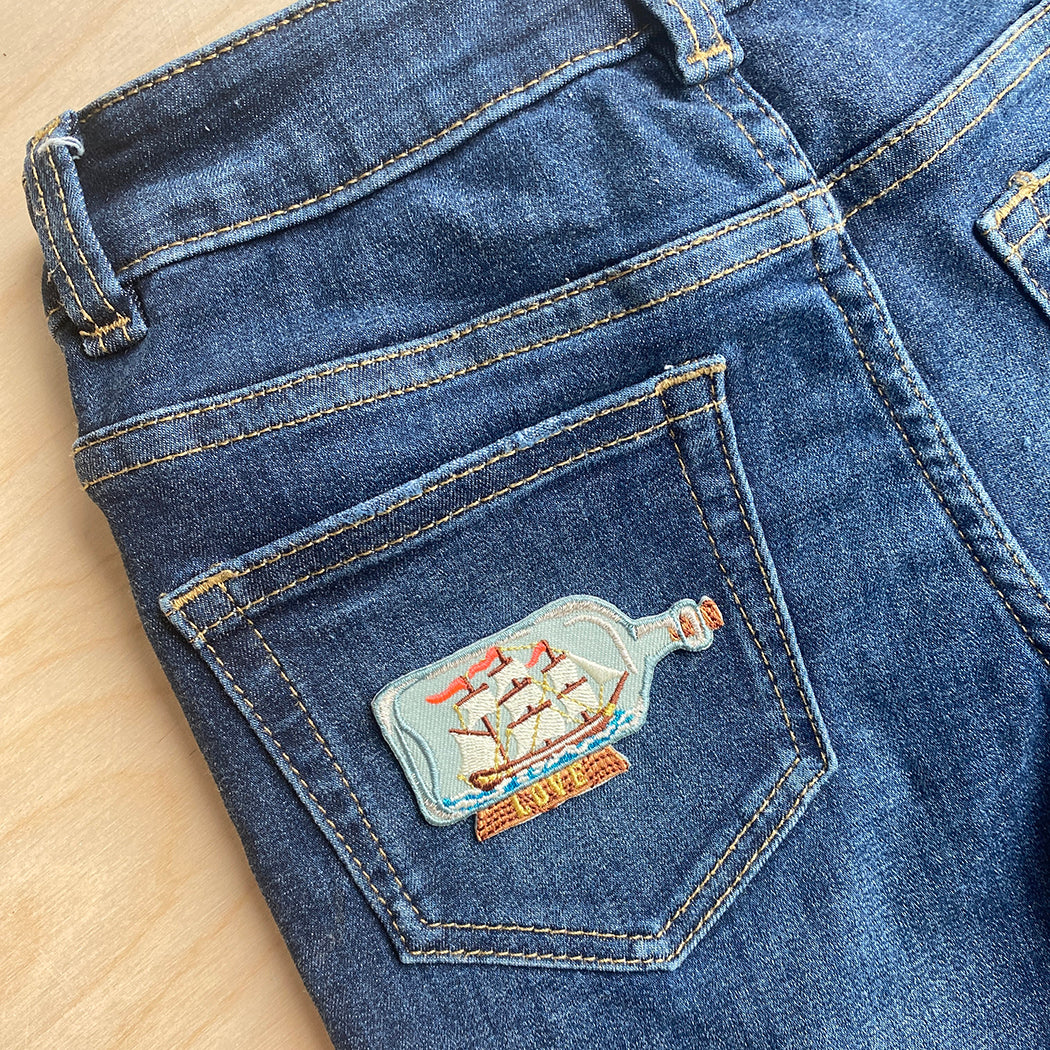 iron on patch on denim jeans back pocket