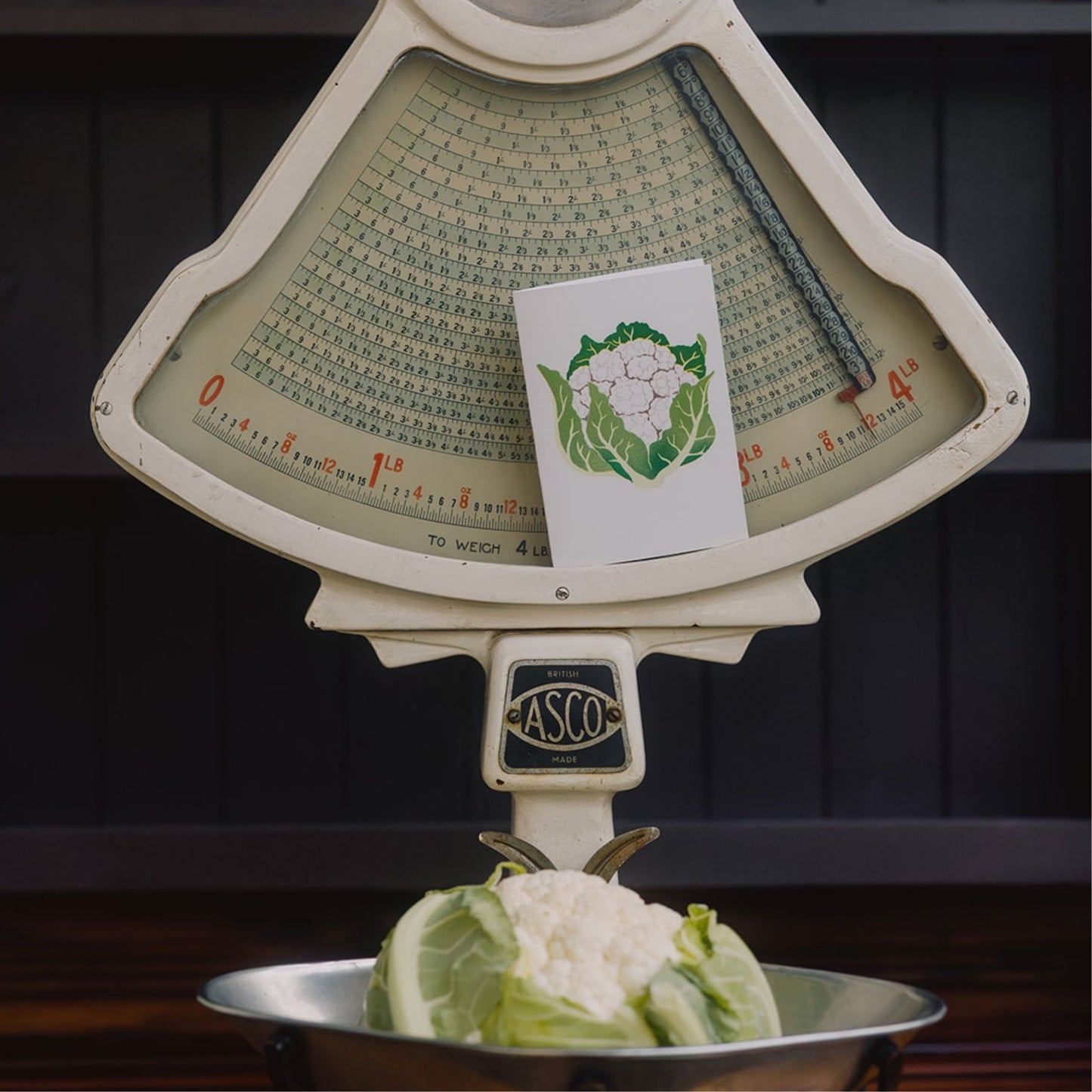 Cauliflower greeting card on vintage scales