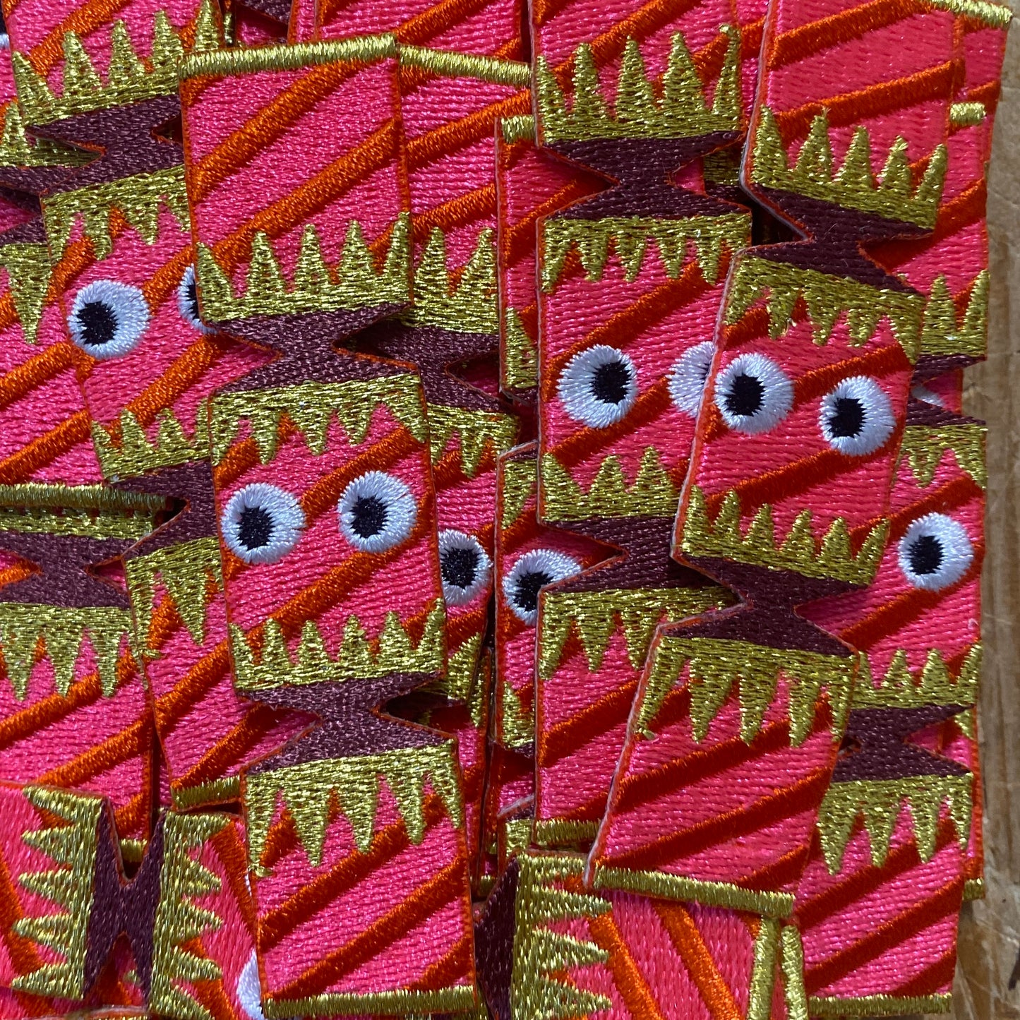 Close up of embroidered Christmas cracker iron on patches 