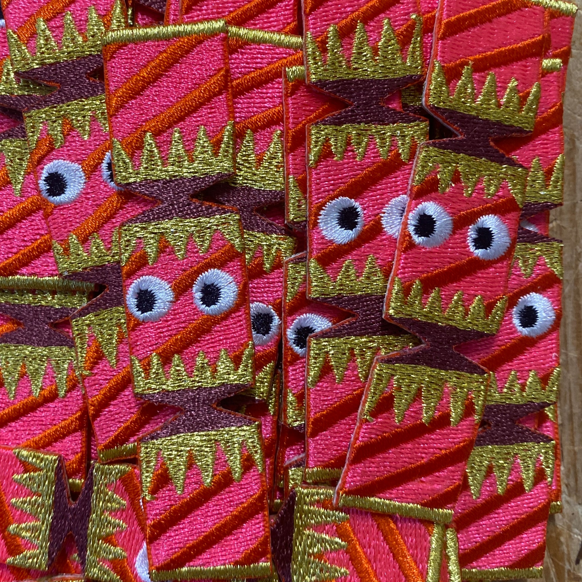 Close up of embroidered Christmas cracker iron on patches 