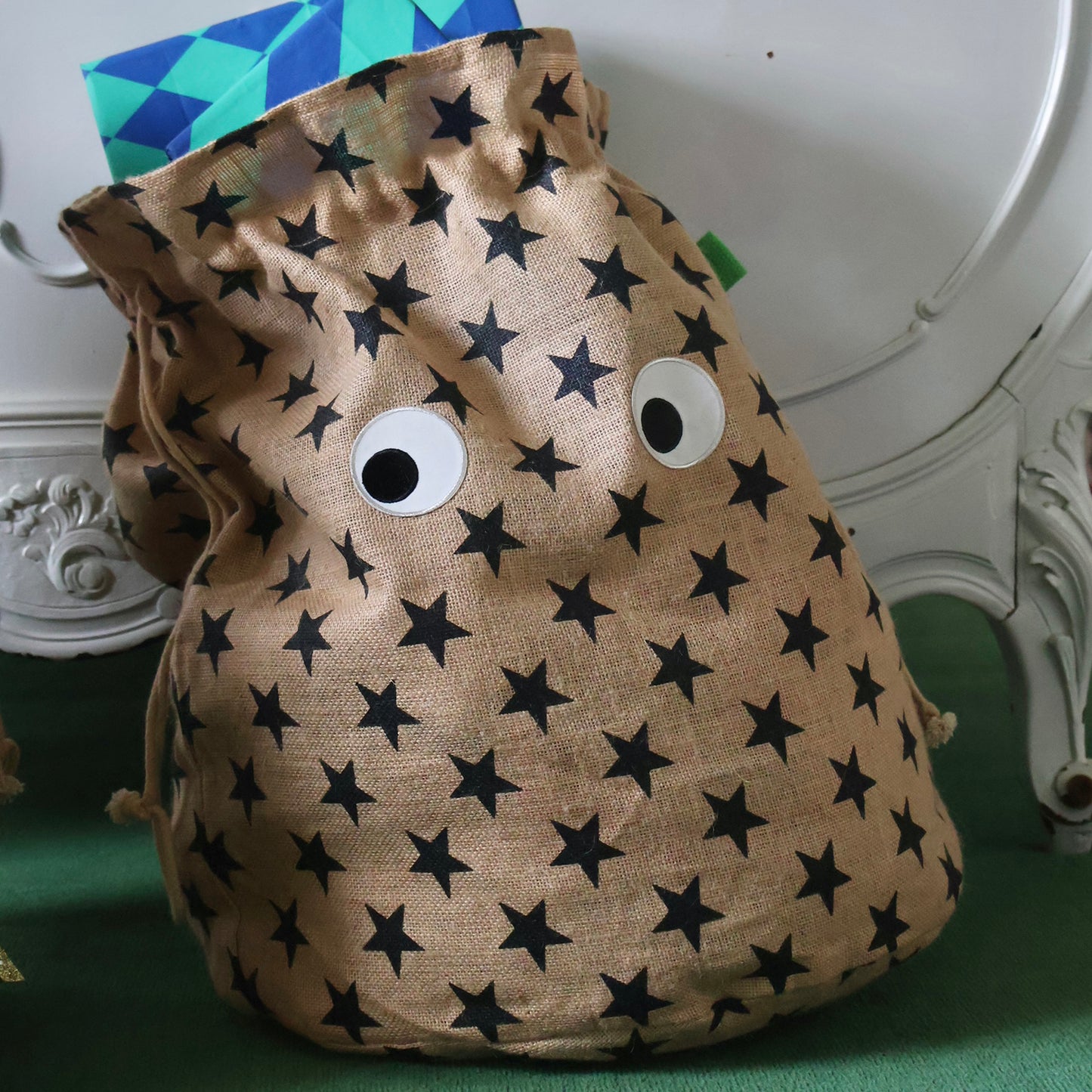 Christmas star print gift sack wth googly eyes | Petra Boase Christmas 