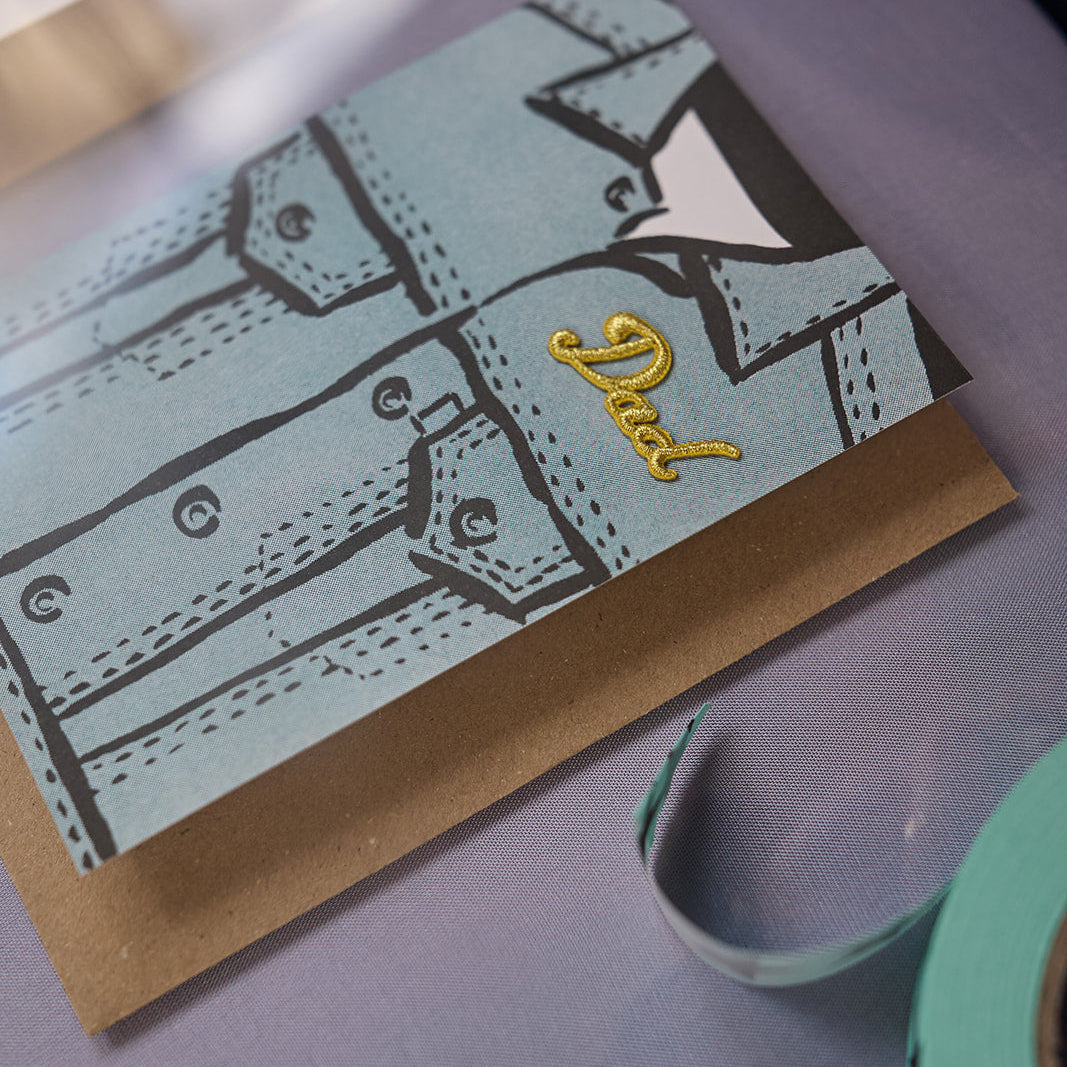 Dad denim jacket risograph printed greeting card in vintage glass cabinet