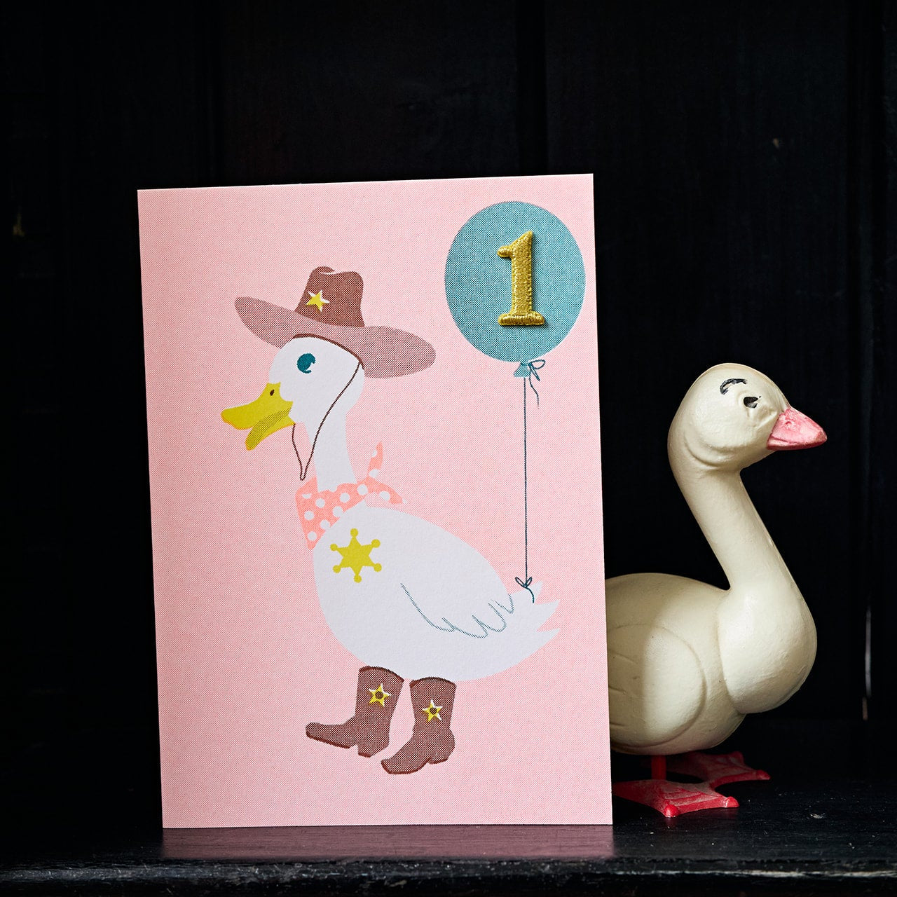 Duck age 1 birthday card on shelf