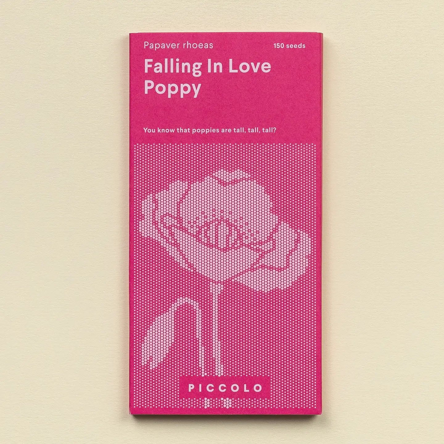 Pink seed packet for 'Falling in Love Poppy' with white text and flower illustration on a beige background