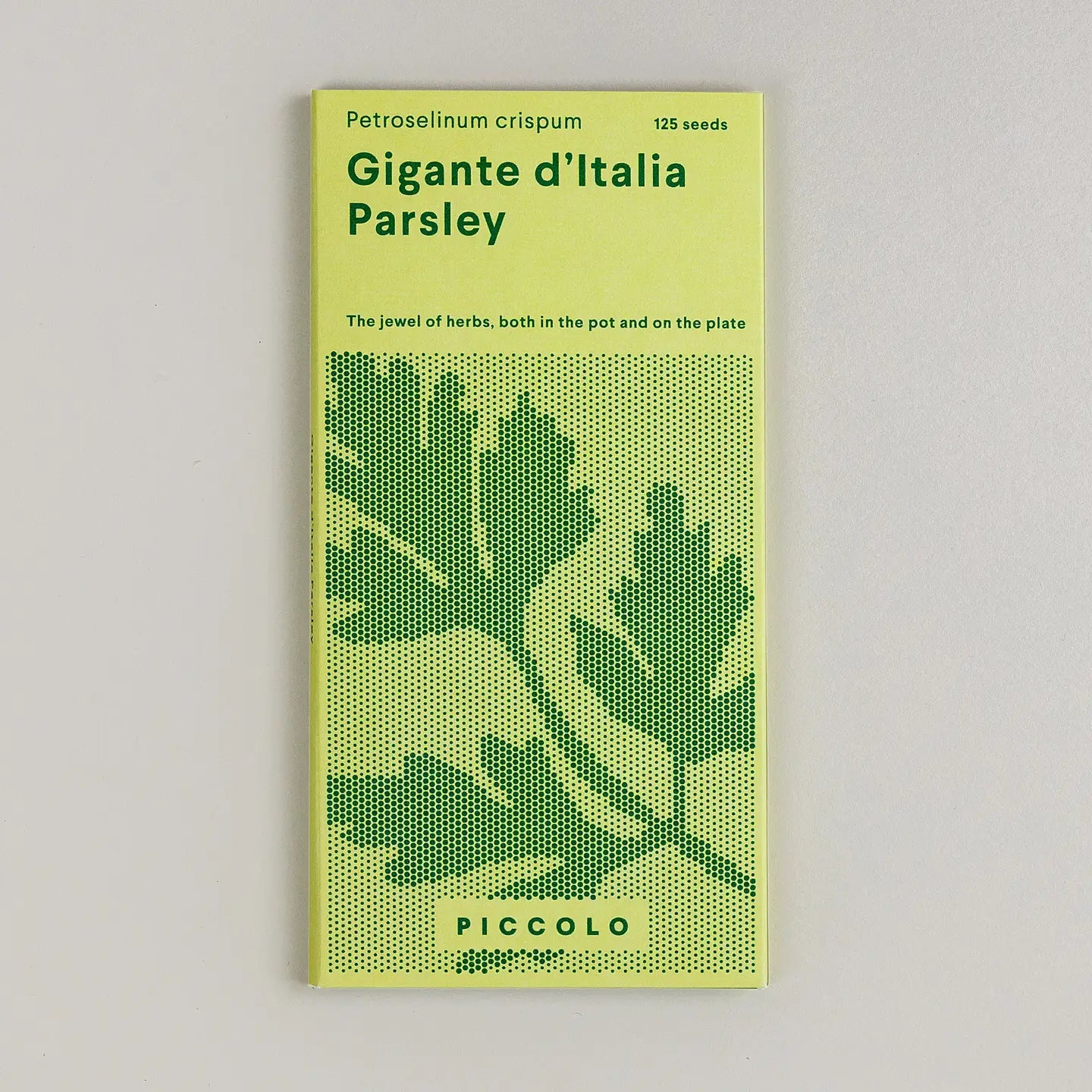 Seed packet for 'Gigante d'Italia Parsley' with green text and parsley leaf design on a light gray background