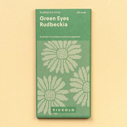 Green package of Rudbeckia seeds with text on a beige background