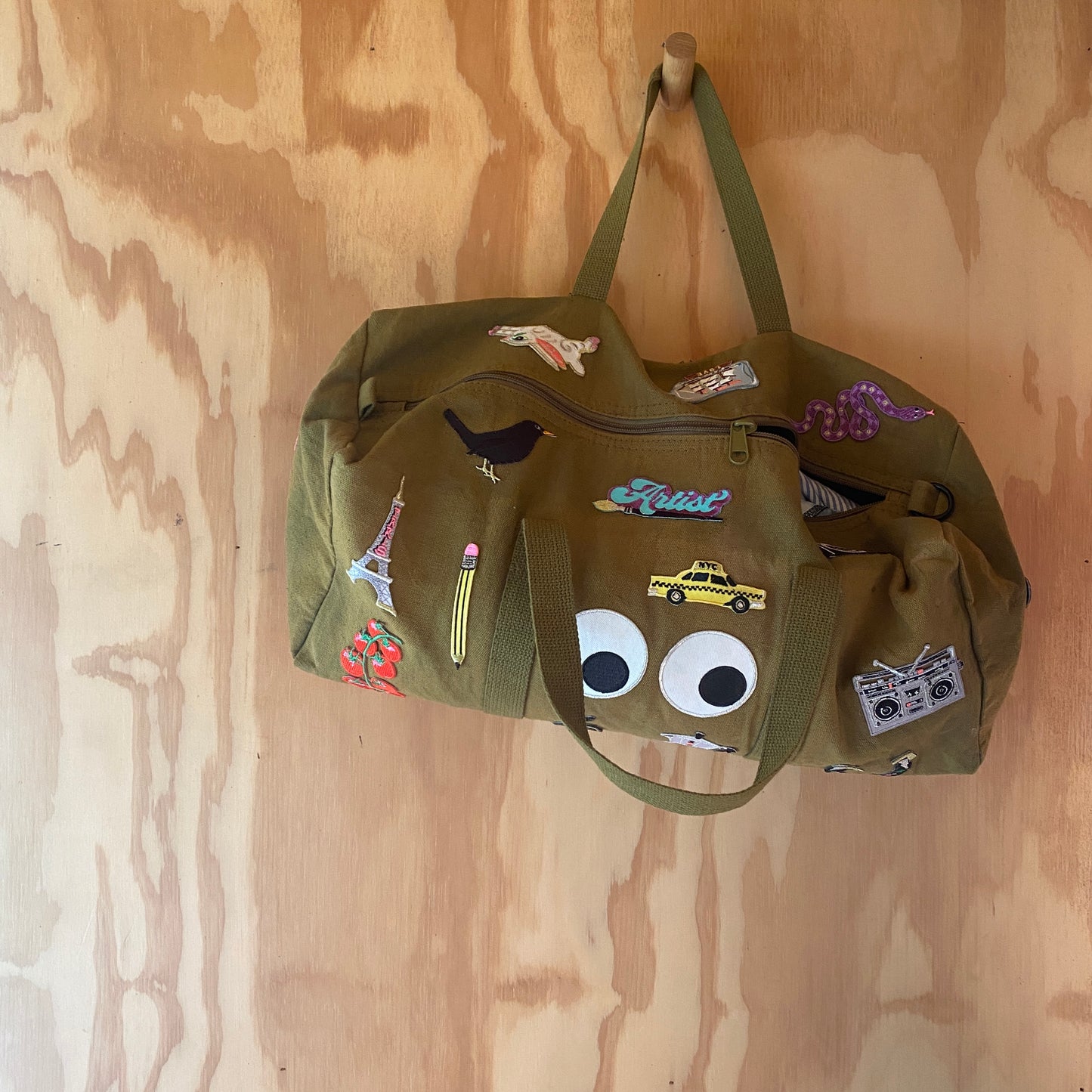 Petra Boase Iron On Patches customising an army bag.