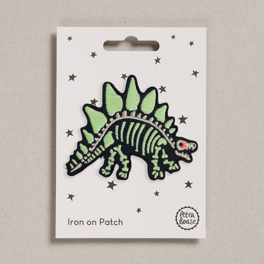 Dinosaur iron on patch with glow in the dark embroidered skeleton