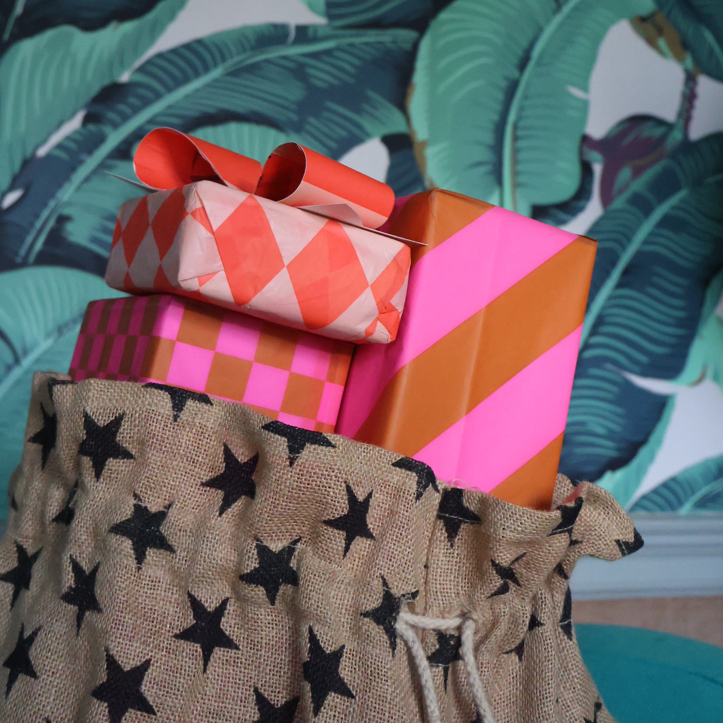 Petra Boase | Star gift sack filled with colourful wrapped presents 