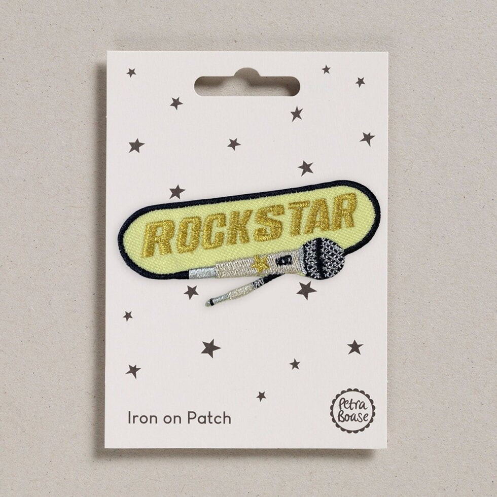 Rockstar iron on patch with a microphone detail.