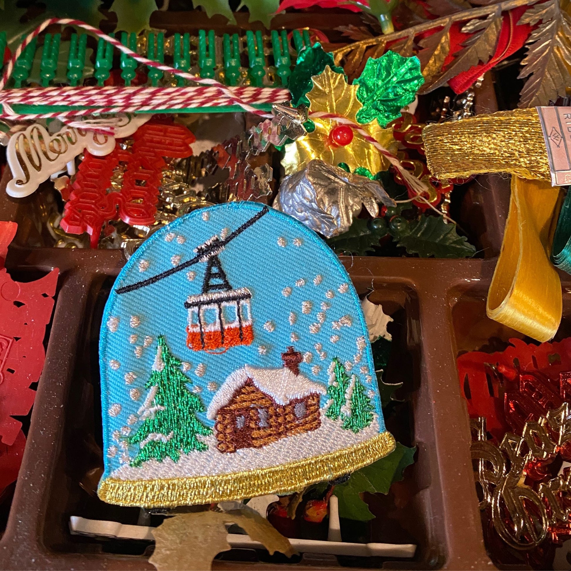 Snow dome iron on patch close up | Petra Boase