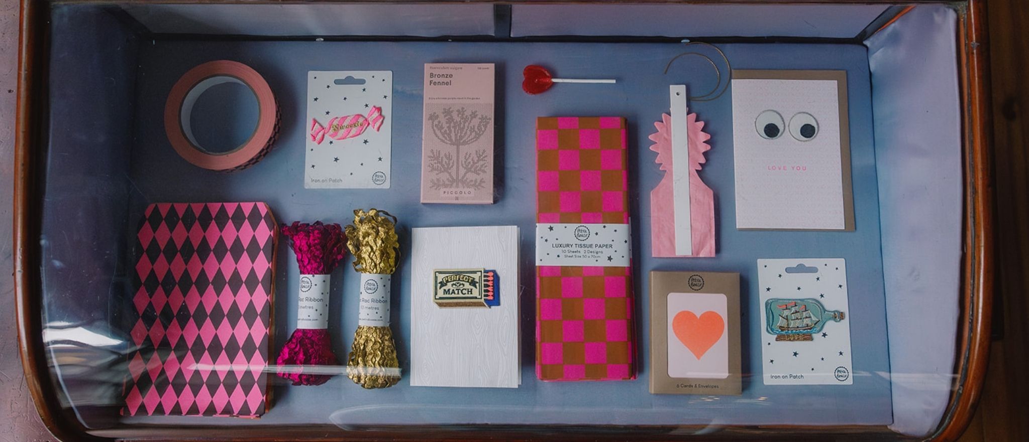 Beautiful Valentine gifts displayed in a vintage half moon display case
