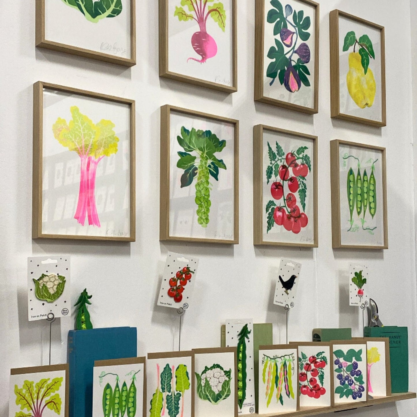 Risograph printed grow cards and prints on the wall 