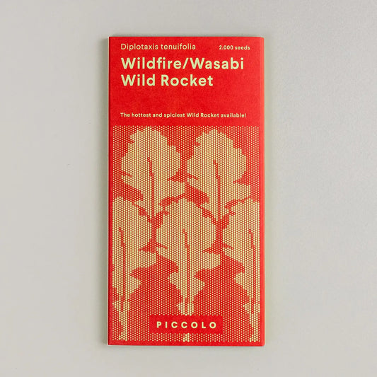 Packaging of Piccolo Wasabi Rocket seeds with red and beige design featuring leaf patterns and product information.
